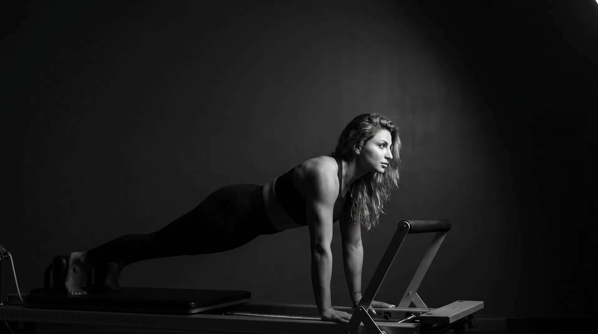 Smart Workout Method founder practicing a specialized rehabilitation exercise on a professional motion-bed trainer